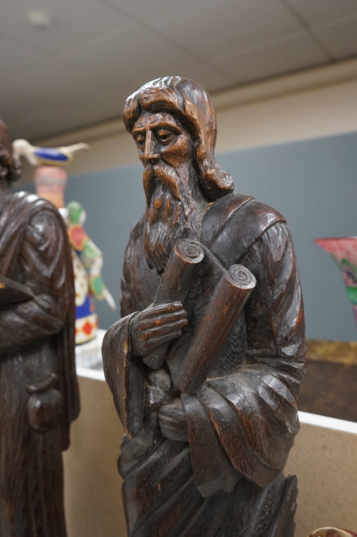 Two 19th century carved wood figures of standing scribes, 67cm